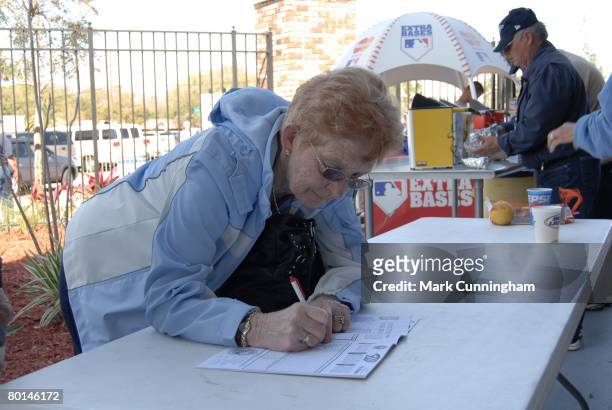 Female fan fills out her scorecard before the spring training game between the Toronto Blue Jays and the Detroit Tigers at Knology Park in Dunedin,...