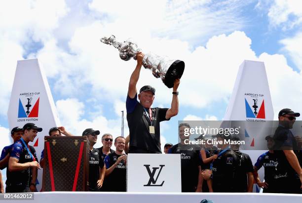 Grant Dalton lifts the cup as Emirates Team New Zealand win race 9 against Oracle Team USA to win the America's Cup on day 5 of the America's Cup...