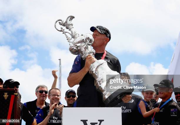 Grant Dalton lifts the cup as Emirates Team New Zealand win race 9 against Oracle Team USA to win the America's Cup on day 5 of the America's Cup...