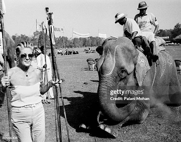 Team supporter helps carry the specialized equipment used at the World Elephant Polo championships December 2002 at Chitwan National Park, Nepal....