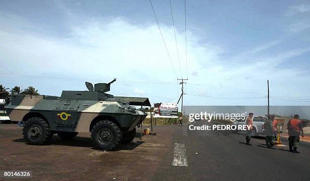 An armoured vehicle of the Venezuelan Army stands in position at a checkpoint Paraguachon, in the state of Maracaibo, in the Venezuelan border with...
