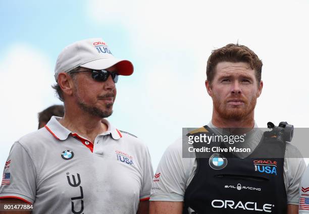 Jimmy Spithill and Larry Ellison of Oracle Team USA look on as Emirates Team New Zealand win race 9 against Oracle Team USA to win the America's Cup...