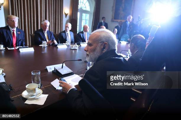 Indian Prime Minister Narendra Modi attends a meeting in the Cabinet Room with U.S. President Donald Trump and members of his cabinet at the White...