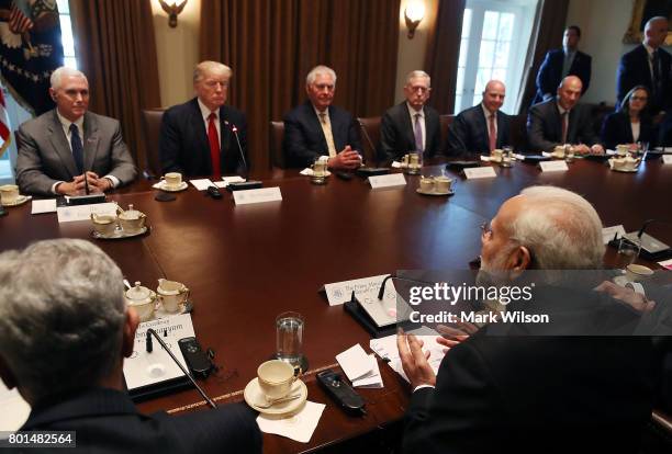 Indian Prime Minister Narendra Modi attends a meeting in the Cabinet Room with U.S. President Donald Trump and members of his cabinet at the White...