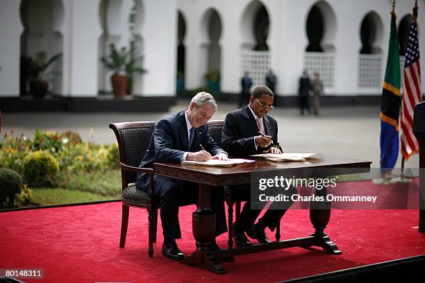 President George W. Bush and Tanzania President Jakaya Kikwete chat while signing the Millennium Challenge Compact aide package February 17, 2008 at...