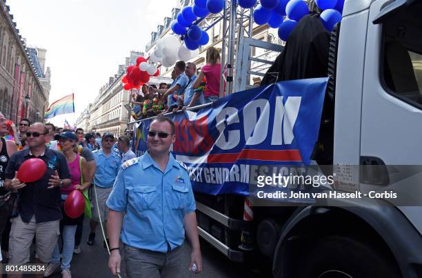 Members of FLAG! the association of gay police officers join a march of up to 500,000 people march to demand equal reproductive rights for gay...