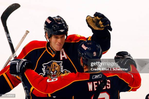 Bryan Allen of the Florida Panthers celebrates a goal with teammate Stephen Weiss against the Pittsburgh Penguins at the Bank Atlantic Center on...