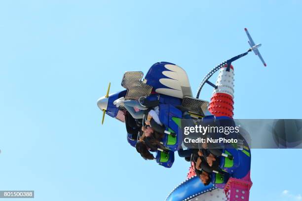 Families and children enjoy the holiday at the amusement park on the second day of Eid al-Fitr in Ankara, Turkey on June 26, 2017.