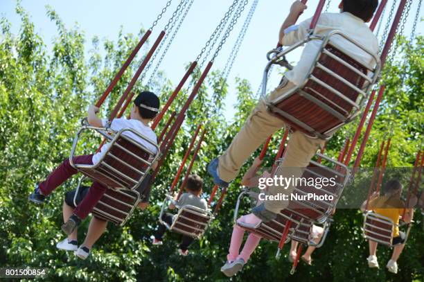 Families and children enjoy the holiday at the amusement park on the second day of Eid al-Fitr in Ankara, Turkey on June 26, 2017.