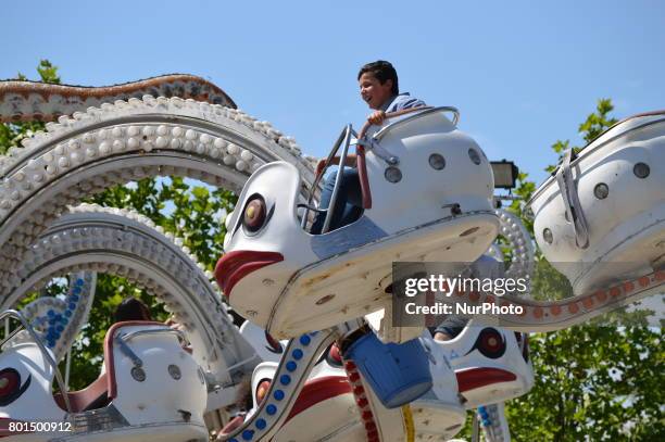 Families and children enjoy the holiday at the amusement park on the second day of Eid al-Fitr in Ankara, Turkey on June 26, 2017.