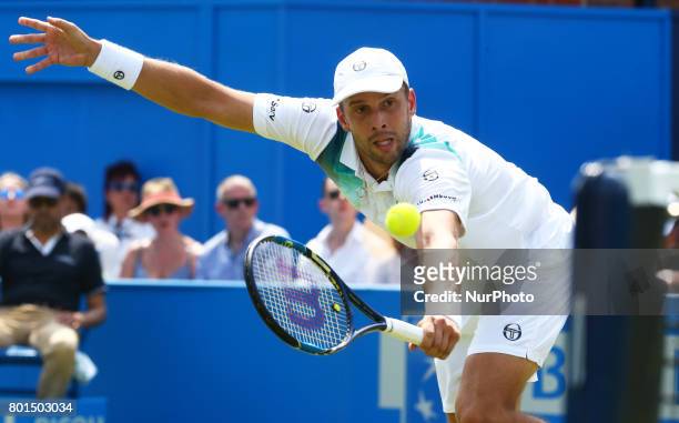 Gilles Muller LUX against Jo-Wilfried Tsonga FRA during Round Two match on the third day of the ATP Aegon Championships at the Queen's Club in west...