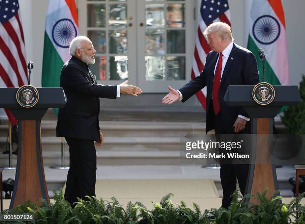 President Donald Trump and Indian Prime Minister Narendra Modi shake hands while delivering joint statements in the Rose Garden of the White House...