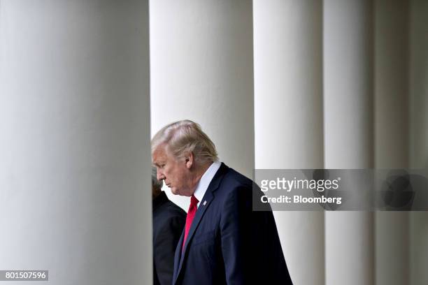 President Donald Trump walks to the Rose Garden of the White House to make a joint statement with Indian Prime Minister Narendra Modi, not pictured,...