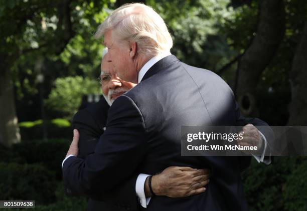 President Donald Trump and Indian Prime Minister Narendra Modi embrace while delivering joint statements in the Rose Garden of the White House June...