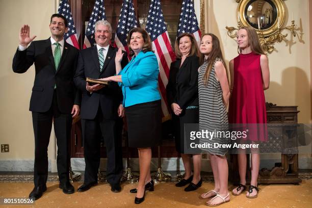 Speaker of the House Paul Ryan, Steve Handel, and Representative-elect Karen Handle participate in a ceremonial swearing-in on Capitol Hill, June 26,...