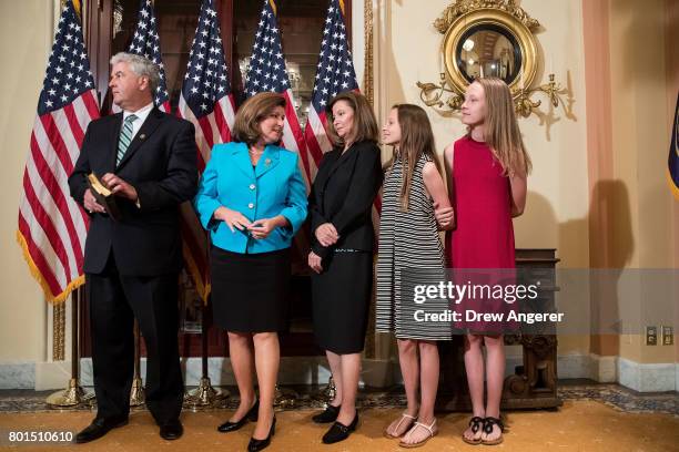 Steve Handel, Representative-elect Karen Handle and family await Speaker of the House Paul Ryan before a ceremonial swearing-in on Capitol Hill, June...