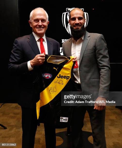 Malcolm Turnbull, Prime Minister of Australia chats to Bachar Houli of the Tigers during the Bachar Houli Programs 2017 AFL Eid Celebration at Punt...
