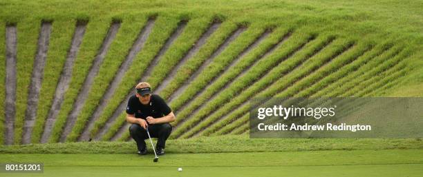 Soren Kjeldsen of Denmark lines up his putt on the second hole during the second round of the Maybank Malaysian Open held at the Kota Permai Golf &...