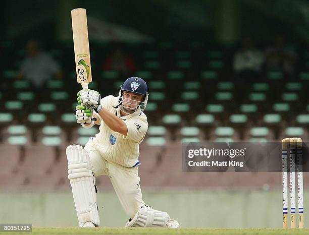 Phil Hughes of the Blues hits a cover drive for four during day one of the Pura Cup match between the New South Wales Blues and the South Australian...