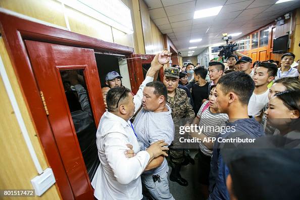 Mongolia Riots Activists from the Mongolian People's Revolutionary Party scuffle ...