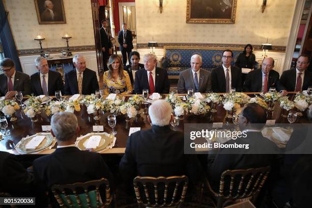 President Donald Trump, center, delivers remarks before dinner with members of his cabinet and Narendra Modi, India's prime minister, at the White...