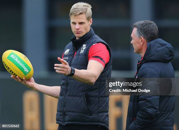 Nick Riewoldt speaks to Saints head coach Alan Richardson during a St Kilda Saints AFL training session at Linen House Oval on June 27, 2017 in...