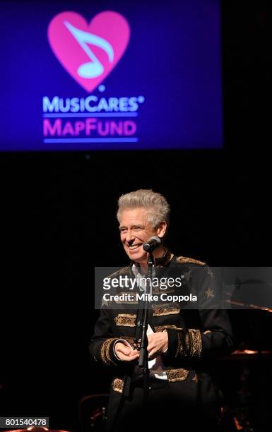 Honoree, Stevie Ray Vaughan Award recipient Adam Clayton of U2 gives his award acceptance speech at the 13th Annual MusiCares MAP Fund Benefit...