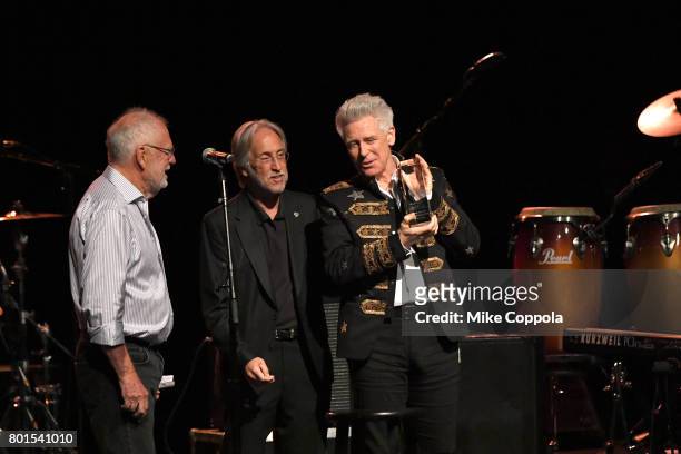 President/CEO of The Recording Academy and MusicCares Neil Portnow and Chris Blackwell present and Honoree Adam Clayton of U2 with Stevie Ray Vaughan...