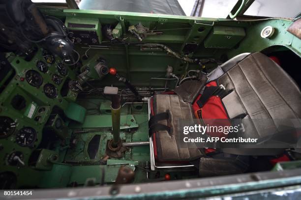 This picture taken on June 6, 2017 shows the cockpit of a restored World War II-era Mitsubishi A6M Type 22 Zero fighter at an airfield in Ryugasaki,...