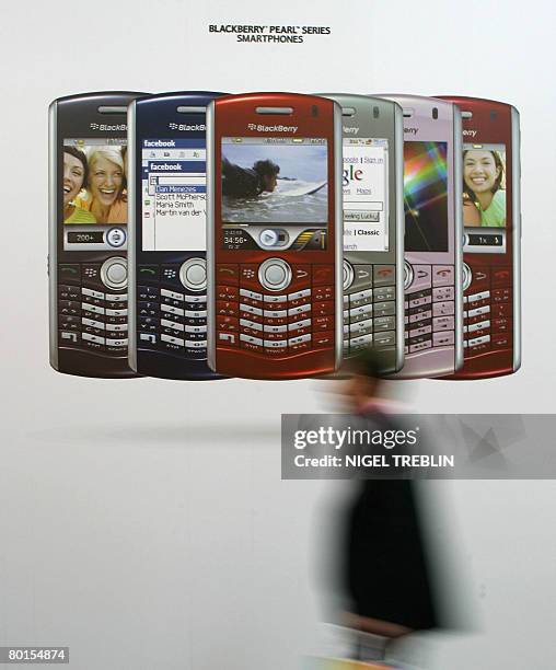 Visitor walks past a display of Blackberry "Smart Phones" at the CeBIT trade fair in Hanover on March 7, 2008. The fair officially runs from 04 to 09...