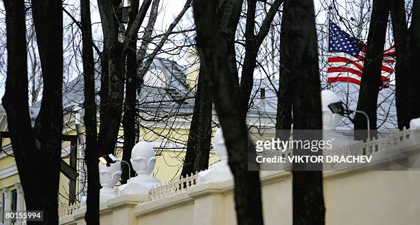 The US national flag flies behind a fence of the embassy of USA in Minsk on March 07, 2008. Belarus on Friday asked the US ambassador to leave the...