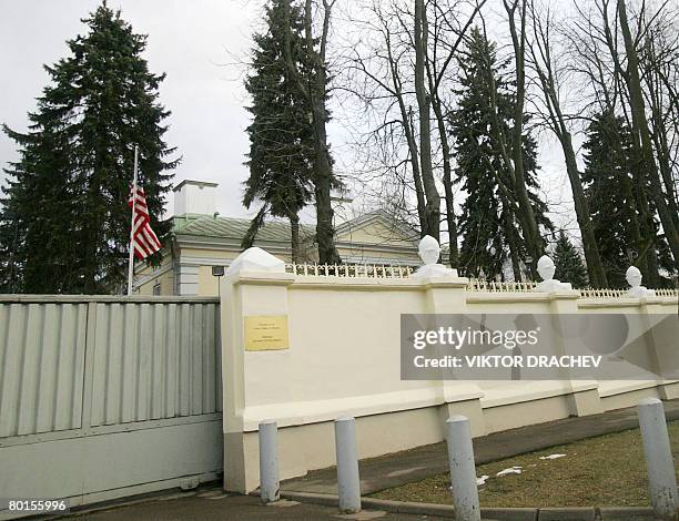 The US national flag is seen behind a fence of the US embassy in Minsk on March 07, 2008. Belarus on March 7, 2008 asked the US ambassador to leave...