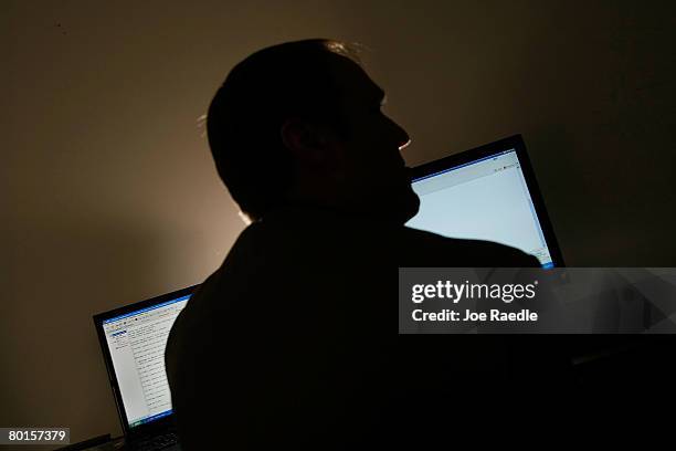 Lt. Mike Baute from Florida's Child Predator CyberCrime Unit talks with people on instant messenger during the unveiling of a new CyberCrimes office...