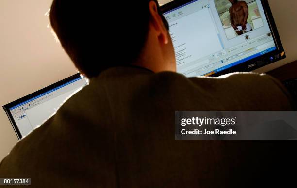 Lt. Mike Baute from Florida's Child Predator CyberCrime Unit talks with a man on instant messenger during the unveiling of a new CyberCrimes office...