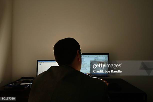 Lt. Mike Baute from Florida's Child Predator CyberCrime Unit talks with people on instant messenger during the unveiling of a new CyberCrimes office...