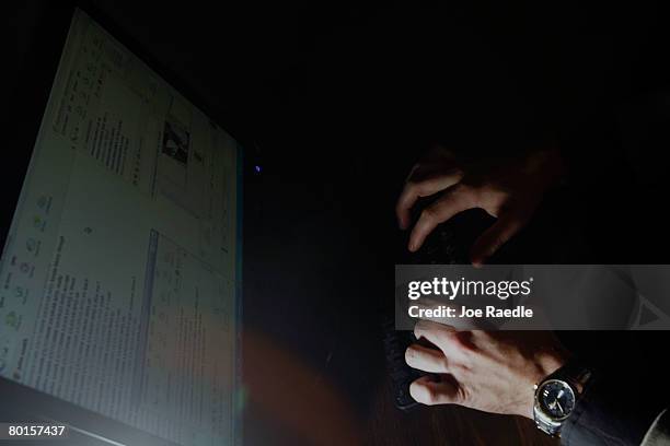 Lt. Mike Baute from Florida's Child Predator CyberCrime Unit talks with people on instant messenger during the unveiling of a new CyberCrimes office...