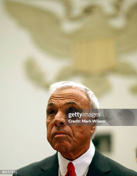 Angelo Mozilo, founder and former CEO, Countrywide Financial Corporation, stands at the witness table before the start of a House Oversight and...