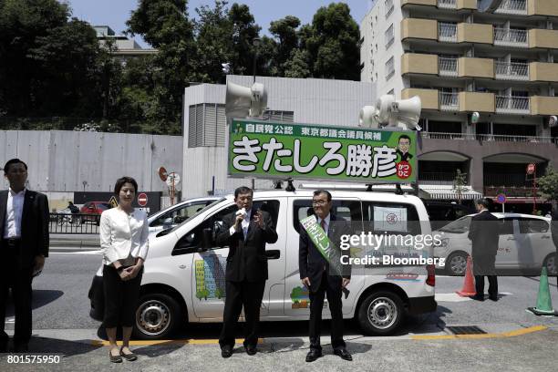 Shigeru Ishiba, a member of the Liberal Democratic Party and the House of Representatives, center left, speaks during an election campaign event for...