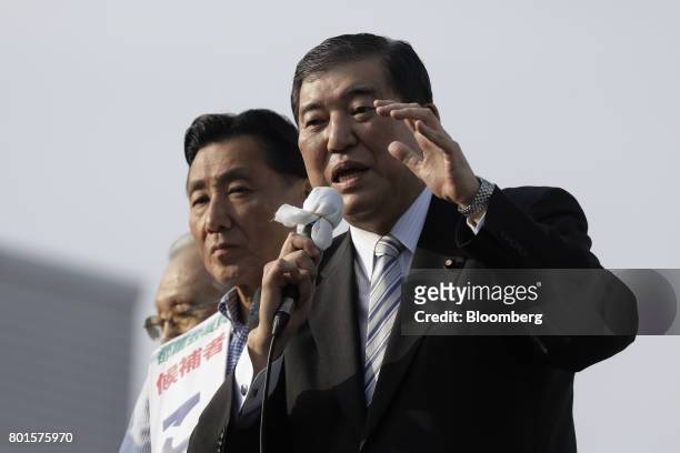 Shigeru Ishiba, a member of the Liberal Democratic Party and the House of Representatives, right, speaks during an election campaign event for Akira...