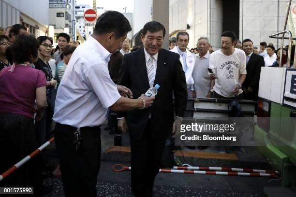 Shigeru Ishiba, a member of the Liberal Democratic Party and the House of Representatives, center, leaves an election campaign event in Tokyo, Japan,...