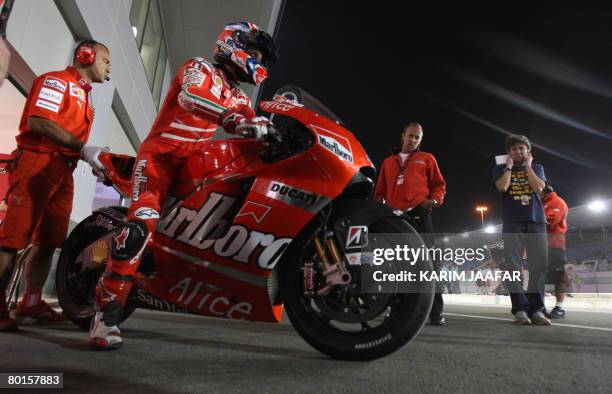Australian rider Casey Stoner rides on his motorcycle during the 2008 MotoGP free practice in Doha on March 7, 2008. World champion Casey Stoner...