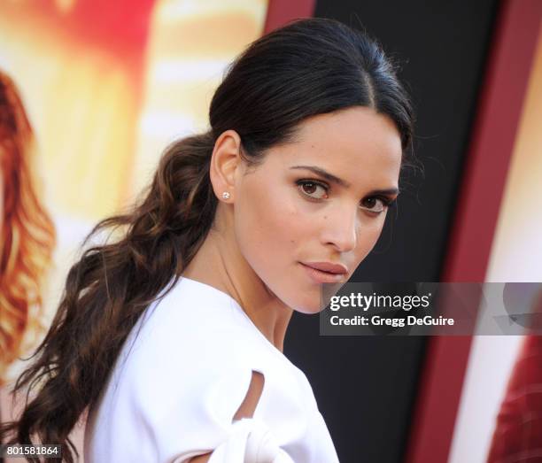 Actress Adria Arjona arrives at the premiere of Warner Bros. Pictures' "The House" at TCL Chinese Theatre on June 26, 2017 in Hollywood, California.