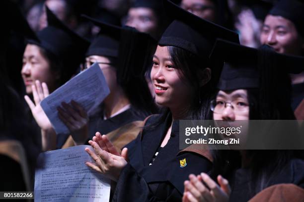 Students react during the graduation ceremony of Shantou University on June 27, 2017 in Shantou, China.