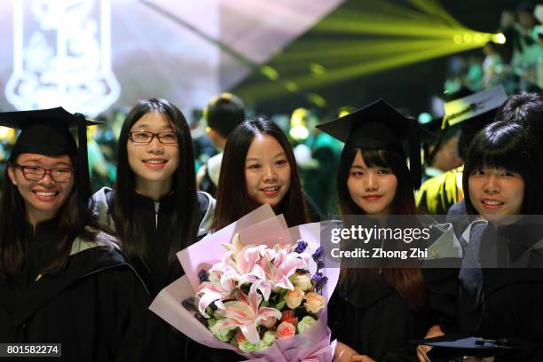 Students react during the graduation ceremony of Shantou University on June 27, 2017 in Shantou, China.