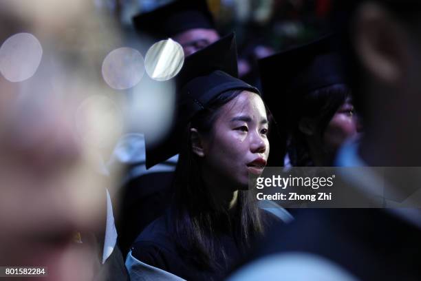 Students react during the graduation ceremony of Shantou University on June 27, 2017 in Shantou, China.