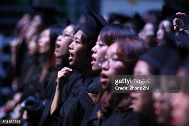 Students react during the graduation ceremony of Shantou University on June 27, 2017 in Shantou, China.