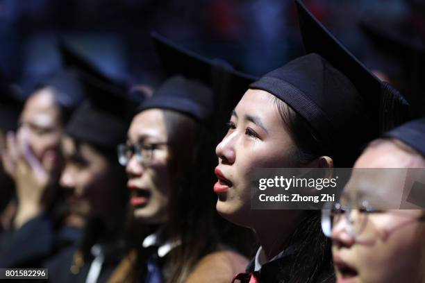 Students react during the graduation ceremony of Shantou University on June 27, 2017 in Shantou, China.