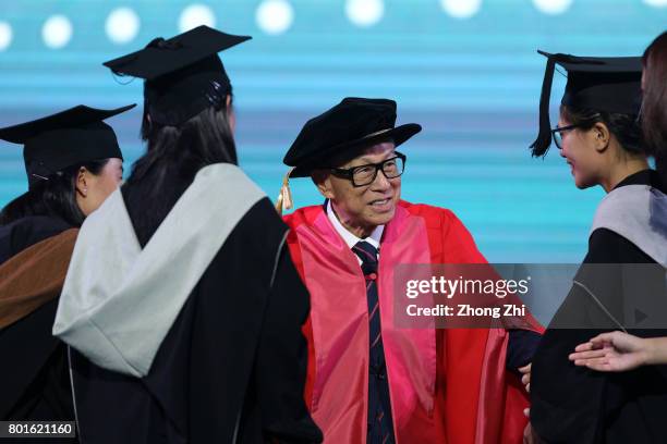 Chinese entrepreneur, Billionaire Li Ka-shing reacts during the graduation ceremony of Shantou University on June 27, 2017 in Shantou, China.