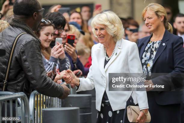 Camilla, Duchess of Cornwall greets members of the public before a reception in Manchester Town Hall to thank those involved during the Manchester...