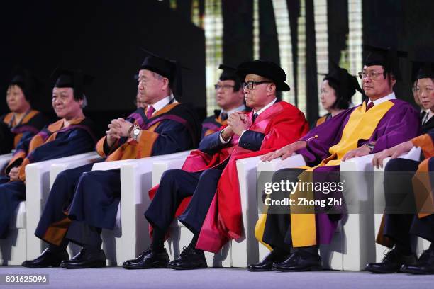 Li Ka-shing, Chinese entrepreneur, Billionaire, and Mo Yan, Chinese novelist and winner of the 2012 Nobel Prize in Literature attend the graduation...